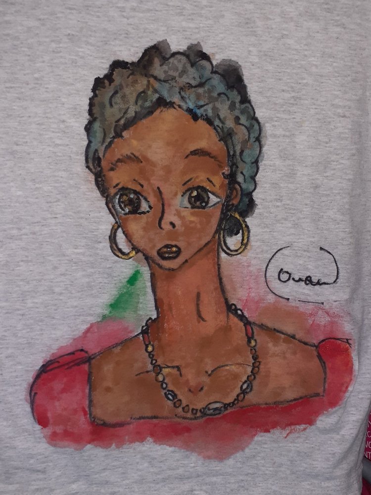 original acrylic art on shirt by Orika reoresenting an afro-caribbean lady in manga-inspired graphic style.